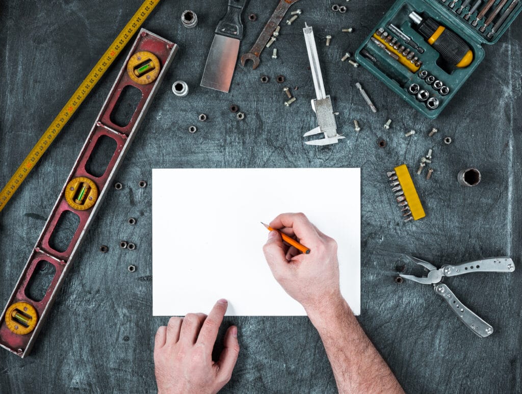 The set of construction tools on wooden table