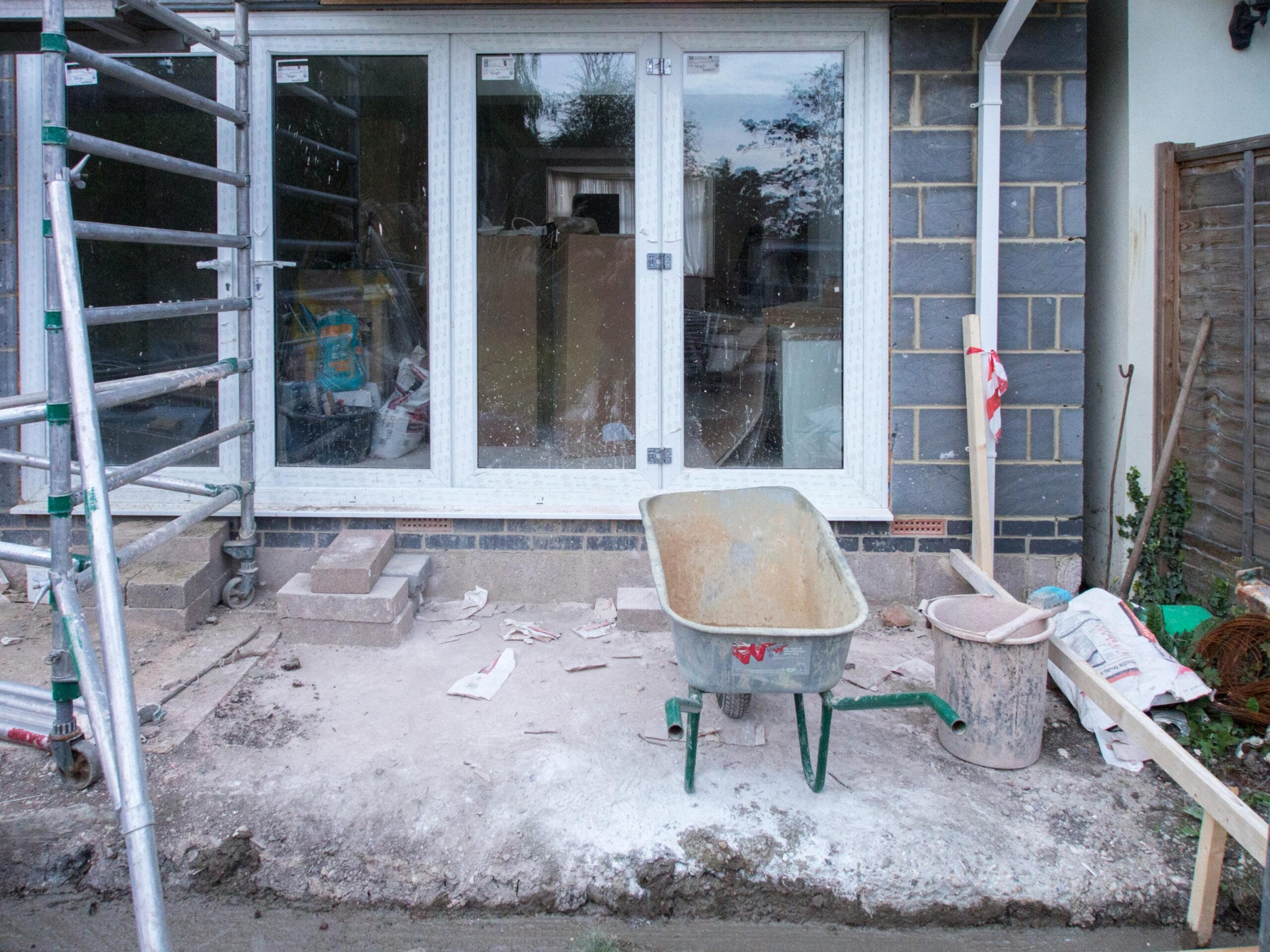 Modern Home Extension Ideas for Contemporary Living A construction site showcasing home renovation with scaffolding and tools.