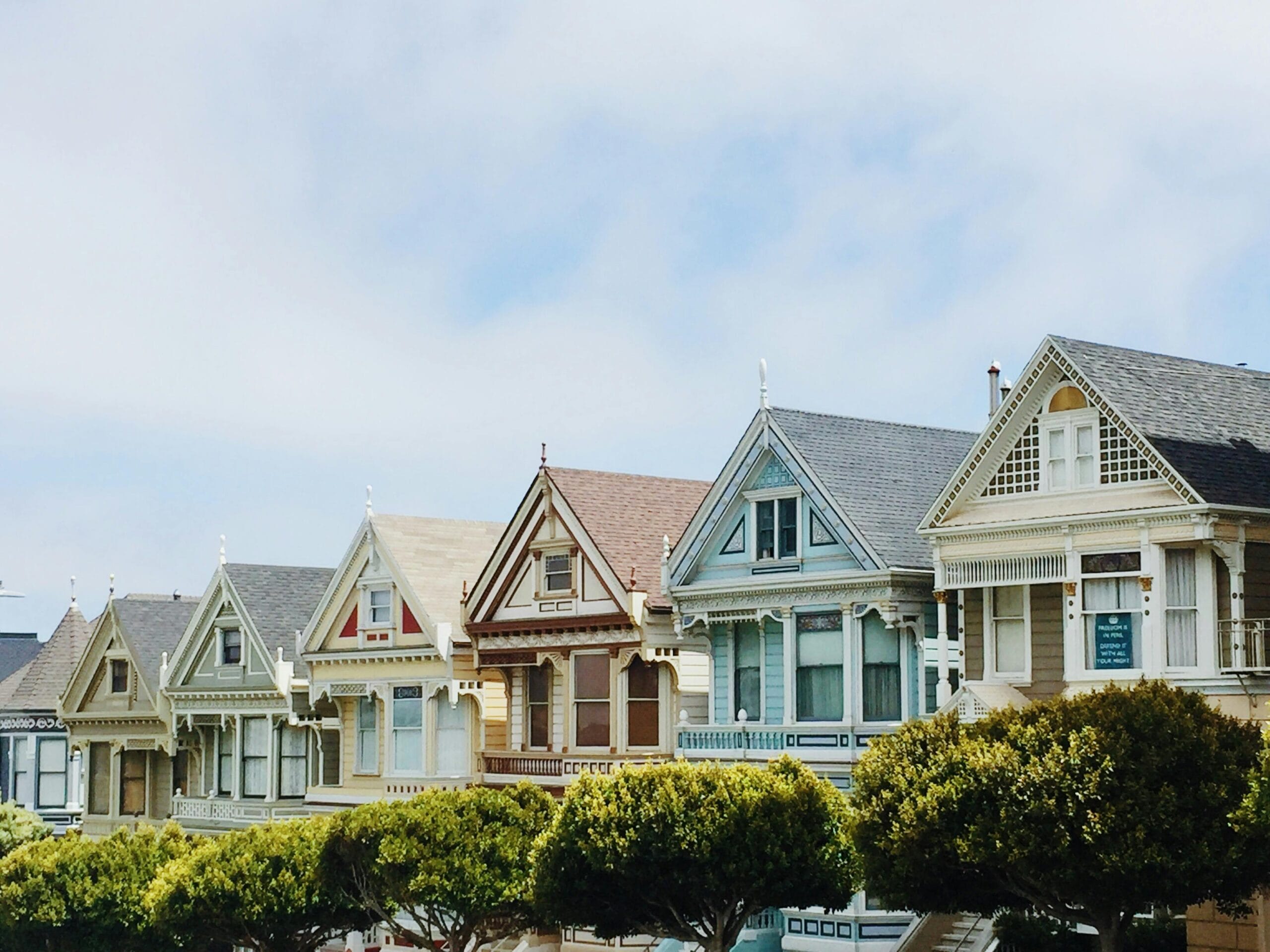 How to Sell My House Fast After a Job Relocation in West Virginia Iconic Painted Ladies Victorian houses in San Francisco with clear blue skies.